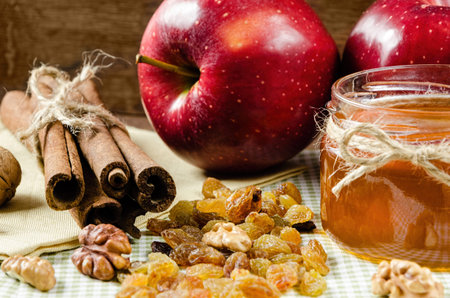 juicy red apples with cinnamon and honey on a napkinの写真素材