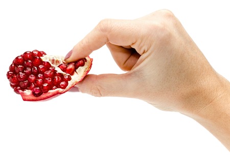 female give or take ruby pomygranate, isolated on white background, health care and right food conceptの写真素材