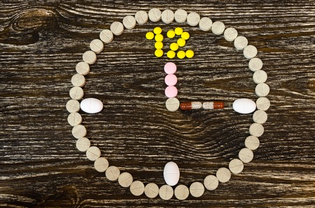 concept of tablets in form of clockの写真素材