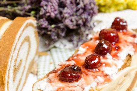 homemade bread with sweet strawberry for breakfast on wooden background.の写真素材