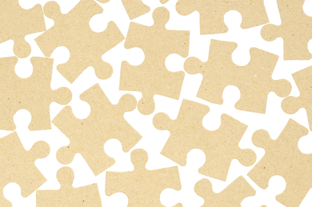 jigsaw puzzles made of cardboard. Isolated on white background. Concept of thinking and relaxationの写真素材