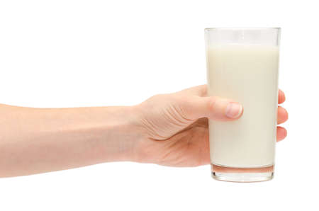hand of young girl holding glass of milk. Isolated on white backgroundの写真素材