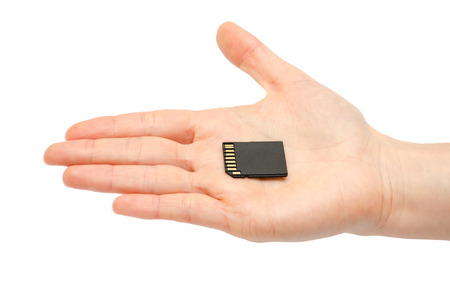 woman hand holding sd flash card. Isolated on white backgroundの写真素材