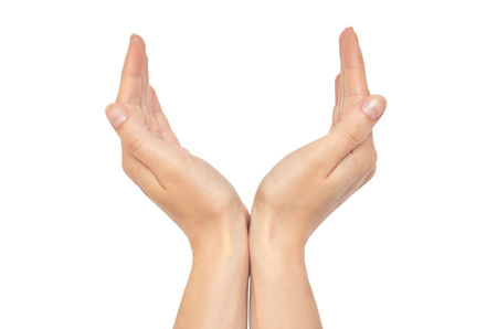 Beautiful female hand protect gesture. Isolated on white background.の写真素材