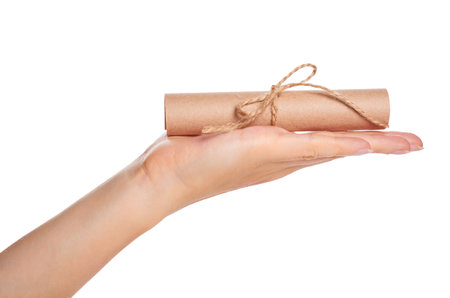 kraft paper scroll in hand isolated on white background.