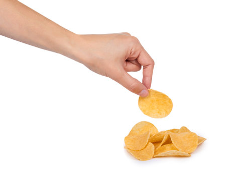 Potato chips in hand isolated on white background.