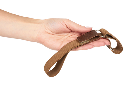 Brown textile kid belt with hand. Isolated on white background. Children clothing accessorry.の写真素材