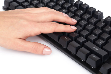 Black mechanical computer keyboard with hand. Isolated on white background.