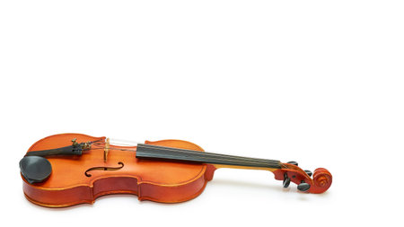 vintage violin worn by time and music masters. Isolated on white background.の写真素材
