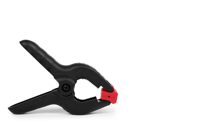 Black plastic clamp isolated on white background. copy space, template.の写真素材