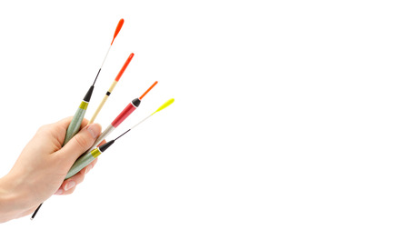 woman hand holding float for fishing. Isolated on white background. copy space, templateの写真素材