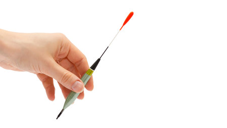 woman hand holding float for fishing. Isolated on white background. copy space, templateの写真素材