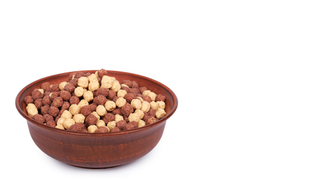 Chocolate breakfast cereal in bowl isolated on white background. copy space, template.の写真素材