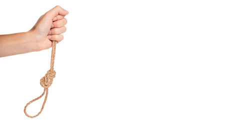 noose, kill rope in hand isolated on white background. copy space, template.の写真素材