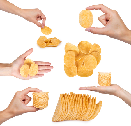 set of different tasty corrugated chips with hand, isolated on white background, potato chips, unhealthy food, many fat and calories.の写真素材