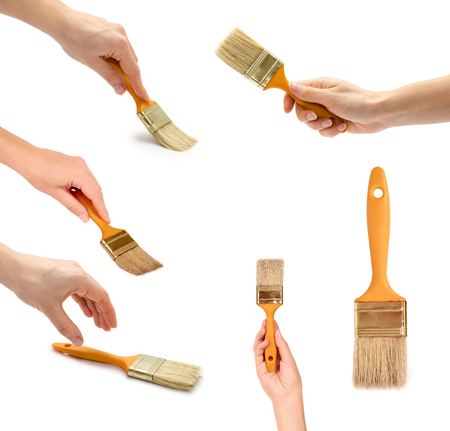 set of different paintbrush with hand. Isolated on white background.の写真素材