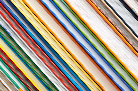 Different colorfull books in stack background image.