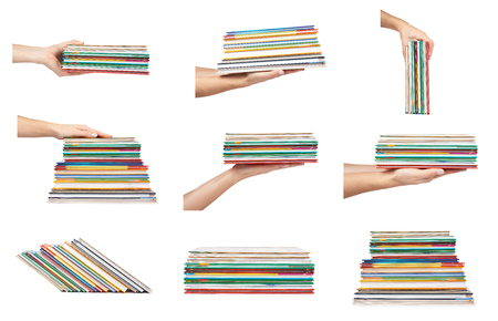 set of different Different colorfull books in stack with hand isolated on white background.の写真素材