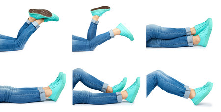 set of different female leg in jeans and sneakers isolated on white background.