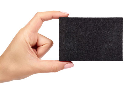 Black sand abrasive bar with hand isolated on white background