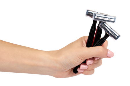 Red disposable shaving razor with hand isolated on white backgroundの写真素材