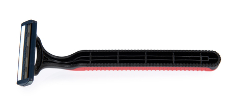 Red disposable shaving razor isolated on white backgroundの写真素材