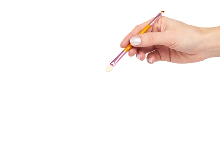 Makeup brush with hand, isolated on white background, copy space template.の写真素材