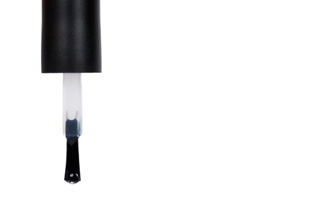 Black nail polish bottle isolated on white background, copy space template.の写真素材
