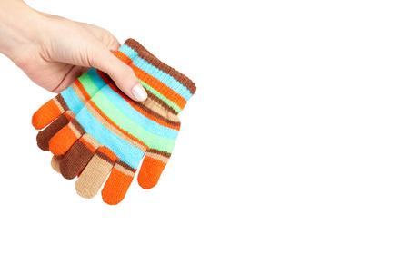 Kid knitted gloves with hand, isolated on white background. copy space template.の写真素材