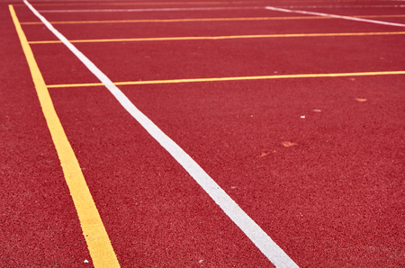 Decorative rubberized Jogging coating at the street stadium in outdoor with white line. Sport Background.の写真素材