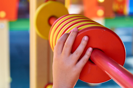 Education counts for children in the public playground, with kid's hand.の写真素材