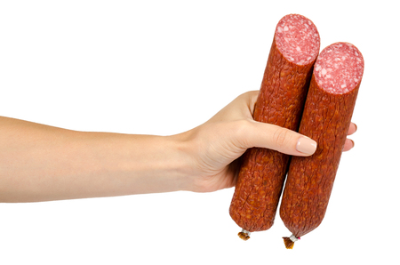 smoked salami sausage piece with hand, isolated on white background.の写真素材