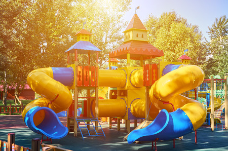 children's playground in a public park, kid's entertainment and recreation, sunlight effect.の写真素材