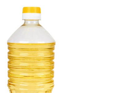 vegetable or sunflower oil in plastic bottle isolated on white background, copy space template.