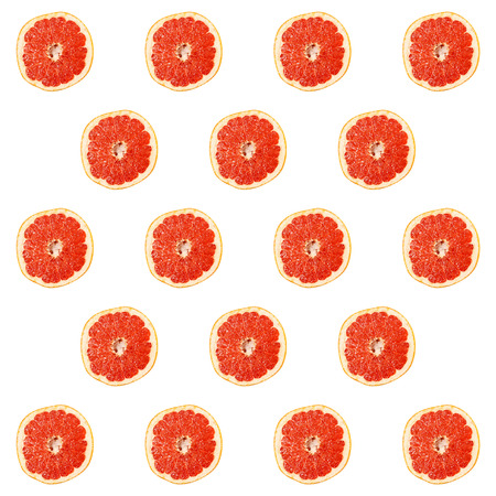 Ripe grapefruit slice pattern isolated on white background.の写真素材