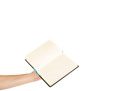 Opened black notebook with hand, isolated on white background, copy space template.