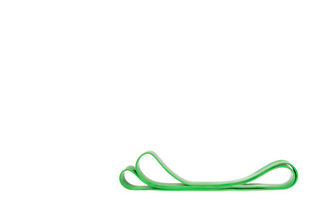 Green resistance band for fitness sport, isolated on white background, copy space template.の写真素材
