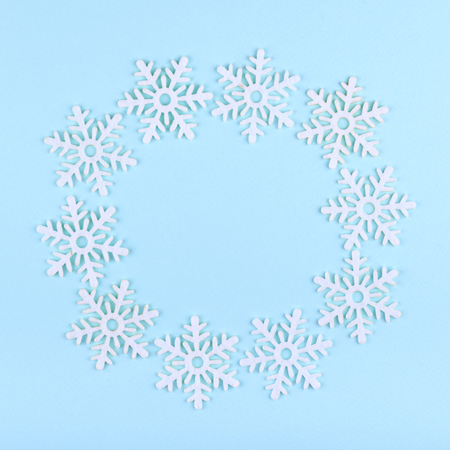 New Year composition with snowflakes. Christmas concept background. Flat lay, top view of festive still life.の写真素材