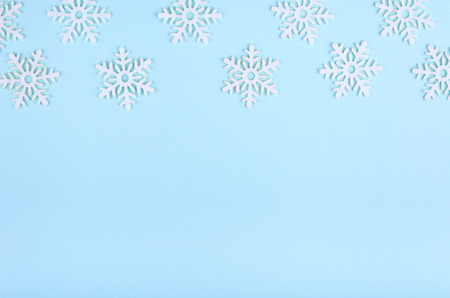 New Year composition with snowflakes. Christmas concept background. Flat lay, top view of festive still life.の写真素材