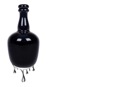 Beautiful black bottle with a water drops from it, isolated on white background, copy space templateの写真素材