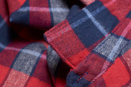 Macro photo of fabric pattern, close up of textile clothing with shallow depth of field. Soft blurred material backgroundの写真素材