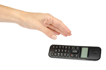 modern landline cordless phone with hand, old technology concept. Isolated on white backgroundの写真素材