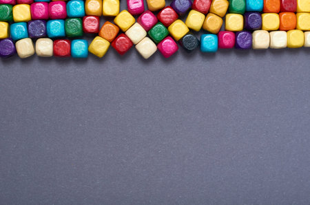 Wooden color beads composition. Needlework concept background. Flat lay and top view photo