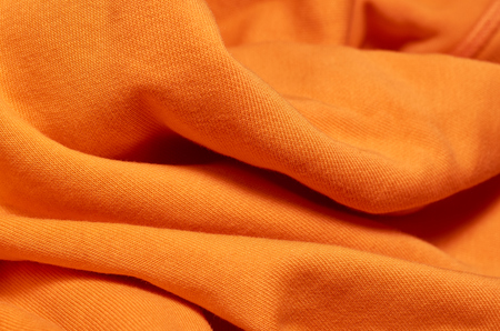 Macro photo of fabric pattern, close up of textile clothing with shallow depth of field. Soft blurred material backgroundの写真素材