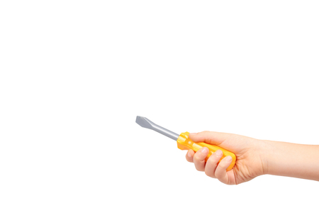 Kids hand with yellow toy screwdriver, repair tool. Isolated on white background. Copy spaceの写真素材