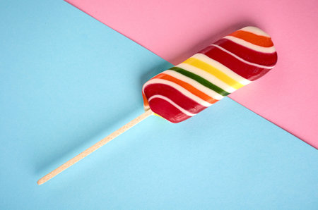 Home made sugar candy, sweet dessert on stick, flat lay composition and top view photo