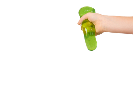 teenager playing green slime with hand, transparent toy. Isolated on white background. Copy space templateの写真素材