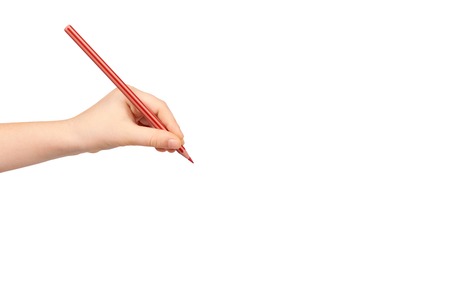 Kid hand holding color pencil, writing and drawing gesture. Isolated on white background. Copy space templateの写真素材