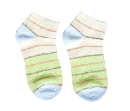 Striped cotton sock, child footwear. Isolated on white backgroundの写真素材
