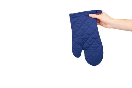 Hand with blue kitchen glove, heat protection and safety. Isolated on white background. Copy space templateの写真素材